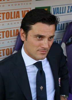 Vincenzo Montella in a suit at a football event