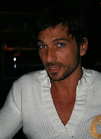 Costantino Vitagliano posing for a photo in a white shirt