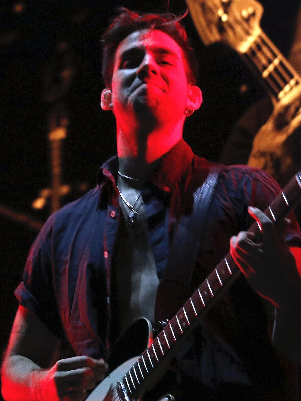 Vicentico performing on stage with Los Fabulosos Cadillacs