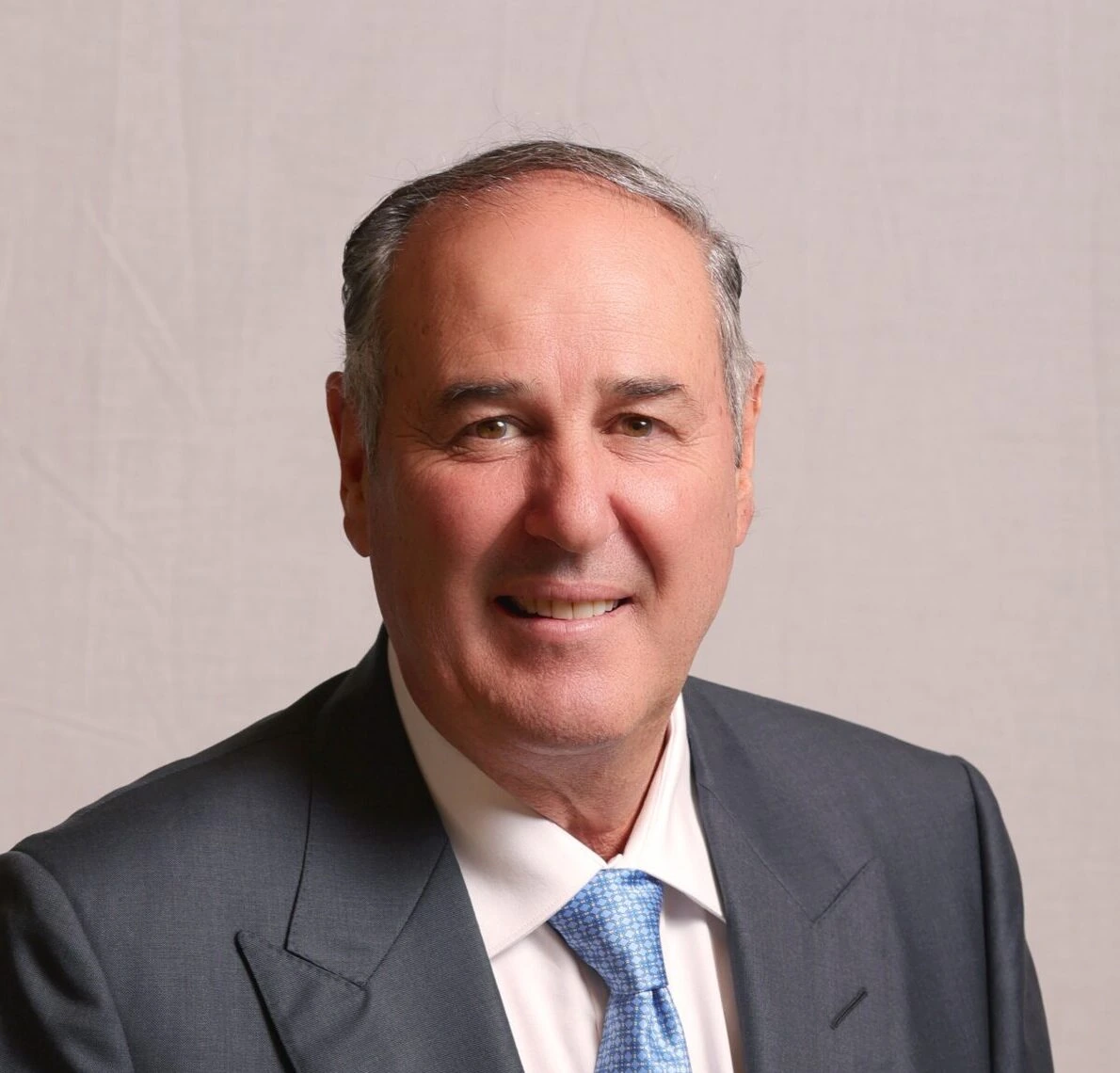 Portrait photo of Arnold Vitocco, Australian property developer and businessman.