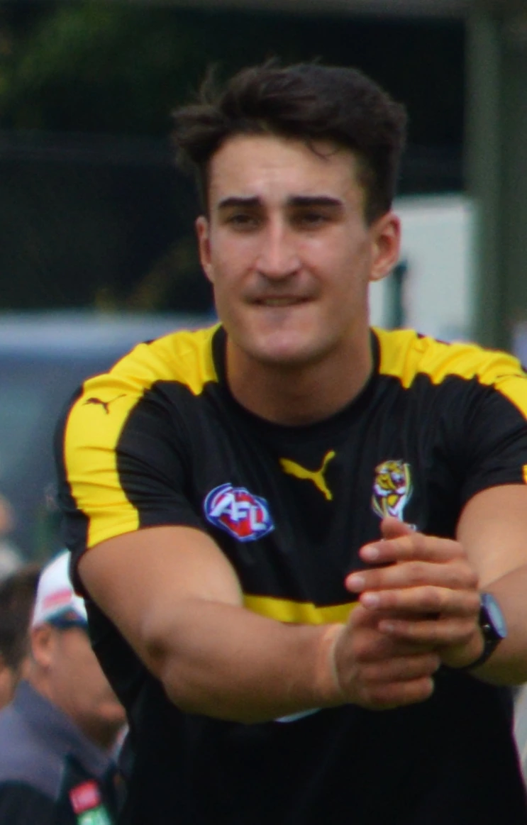 Ivan Soldo, AFL footballer, in a black and yellow training top
